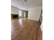 Spacious living room featuring a brick fireplace and laminate wood floors at , Las Vegas, NV 89103
