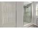 Modern bathroom with sleek glass-enclosed shower and elegant tile work at 10160 W Meranto Ave, Las Vegas, NV 89178