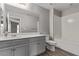Well-lit bathroom features a shower-tub and vanity with modern fixtures at 10160 W Meranto Ave, Las Vegas, NV 89178