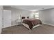 Cozy bedroom with a queen-sized bed, nightstand, and natural light at 10160 W Meranto Ave, Las Vegas, NV 89178