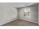 Neutral bedroom featuring carpet and a bright window at 10160 W Meranto Ave, Las Vegas, NV 89178
