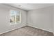 Well-lit bedroom with carpet and a view of the neighborhood at 10160 W Meranto Ave, Las Vegas, NV 89178
