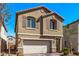 Attractive two-story home featuring stone accents and stylish window shutters at 10160 W Meranto Ave, Las Vegas, NV 89178