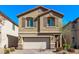 Charming two-story home with a two-car garage and well-maintained landscaping at 10160 W Meranto Ave, Las Vegas, NV 89178