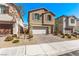 Well-kept two-story house with charming facade and paved driveway at 10160 W Meranto Ave, Las Vegas, NV 89178