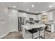 Modern kitchen features white cabinets, stainless steel appliances, and granite countertops at 10160 W Meranto Ave, Las Vegas, NV 89178