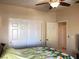 Bedroom with closet with sliding doors and an open door, and window for natural light at 11031 Mission Lakes Ave, Las Vegas, NV 89134