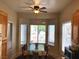 Bright breakfast nook features a ceiling fan, bay window, and room for a quaint dining set at 11031 Mission Lakes Ave, Las Vegas, NV 89134