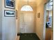 Welcoming entryway with golf themed decor, opening to the kitchen area at 11031 Mission Lakes Ave, Las Vegas, NV 89134