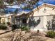 Well-kept, single-story home featuring desert landscaping and exterior window screens at 11031 Mission Lakes Ave, Las Vegas, NV 89134