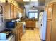 Well-equipped kitchen with wooden cabinets, granite countertops, and modern appliances at 11031 Mission Lakes Ave, Las Vegas, NV 89134