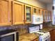 Close up view of gas range, granite countertops and decorative backsplash in the kitchen at 11031 Mission Lakes Ave, Las Vegas, NV 89134