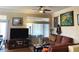 Comfortable living room with plush sofa, large windows, and contemporary decor at 11031 Mission Lakes Ave, Las Vegas, NV 89134