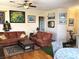 Inviting living room with comfortable seating, artful decor, and bright lighting at 11031 Mission Lakes Ave, Las Vegas, NV 89134