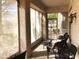 Covered patio with woven patio furniture and views of backyard at 11031 Mission Lakes Ave, Las Vegas, NV 89134