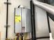 Efficient Rinnai tankless water heater installation with visible pipes and connections at 11031 Mission Lakes Ave, Las Vegas, NV 89134
