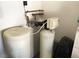 Close-up of water softener system, showcasing the Culligan filtration components at 11031 Mission Lakes Ave, Las Vegas, NV 89134