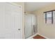 Bathroom showcasing a shower with sliding glass doors and a white door at 11620 Longhirst Hall Ln, Las Vegas, NV 89138
