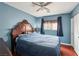 Comfortable bedroom featuring a large bed, hardwood floors, and ample closet space at 11620 Longhirst Hall Ln, Las Vegas, NV 89138