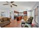 Open-concept living space flows into the kitchen with tile flooring and modern finishes at 11620 Longhirst Hall Ln, Las Vegas, NV 89138