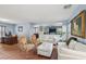 Cozy living space features tile floors, a comfortable seating area, and office space at 11620 Longhirst Hall Ln, Las Vegas, NV 89138