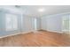 Large bedroom with wood floors, and ensuite bathroom at 11673 Pride Hill St, Las Vegas, NV 89183