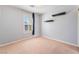 Bedroom with a window, neutral carpet and two shelves at 11673 Pride Hill St, Las Vegas, NV 89183