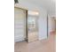 Bedroom closet with mirror doors and shelving units for maximum storage, carpeted floors, and neutral color scheme at 11673 Pride Hill St, Las Vegas, NV 89183
