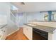 Kitchen sink and island with black counter top and view of staircase at 11673 Pride Hill St, Las Vegas, NV 89183