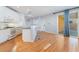 Bright kitchen featuring white cabinets, a breakfast bar, and seamless flow to the outdoor patio at 11673 Pride Hill St, Las Vegas, NV 89183