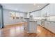Modern kitchen featuring white cabinetry, stainless appliances, and breakfast bar with seating at 11673 Pride Hill St, Las Vegas, NV 89183