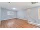 Upstairs loft area with wood floors, neutral walls, and natural light at 11673 Pride Hill St, Las Vegas, NV 89183