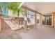 A covered patio area with access to the backyard, a concrete slab, and a sliding glass door at 11673 Pride Hill St, Las Vegas, NV 89183
