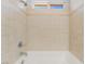 Close-up of the tiled shower/tub with a shower head at 11673 Pride Hill St, Las Vegas, NV 89183
