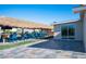 Expansive backyard features a thatched tiki bar, and lush lawn providing ample space for relaxation and recreation at 120 Chartan Ave, Las Vegas, NV 89183