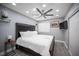 Bedroom features gray walls, ceiling fan and hardwood floors at 120 Chartan Ave, Las Vegas, NV 89183
