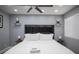 Bedroom features gray walls, ceiling fan and hardwood floors at 120 Chartan Ave, Las Vegas, NV 89183