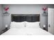 Comfortable bedroom features a padded headboard and stylish decor at 120 Chartan Ave, Las Vegas, NV 89183