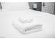 Close-up of a neatly made bed with soft, white linens at 120 Chartan Ave, Las Vegas, NV 89183