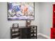 Kitchen with coffee and toaster on a bar, bright artwork, and red cabinet at 120 Chartan Ave, Las Vegas, NV 89183