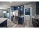 Contemporary kitchen with stainless steel refrigerator and modern lighting, perfect for cooking at 120 Chartan Ave, Las Vegas, NV 89183