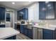 Modern kitchen with stainless steel appliances, and stylish cabinetry, offering ample counter space at 120 Chartan Ave, Las Vegas, NV 89183