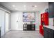 Open kitchen featuring gray wood floors, grey cabinets, and stainless steel appliances at 120 Chartan Ave, Las Vegas, NV 89183