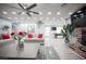 Bright living room featuring hardwood floors, a ceiling fan, recessed lighting, and neutral-tone sofas at 120 Chartan Ave, Las Vegas, NV 89183