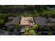 A sprawling estate with a red tile roof nestled amongst lush greenery near a golf course at 12097 Oakland Hills Dr, Las Vegas, NV 89141