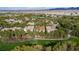 Lush landscaping surrounds a luxury home near a golf course, offering stunning views and a serene setting at 12097 Oakland Hills Dr, Las Vegas, NV 89141