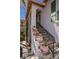 Charming exterior steps adorned with potted flowers, adding to the home's curb appeal at 12097 Oakland Hills Dr, Las Vegas, NV 89141