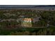Picturesque aerial image of a luxurious home near a lush golf course, offering privacy and scenic views at 12097 Oakland Hills Dr, Las Vegas, NV 89141