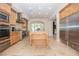 Spacious kitchen featuring stainless steel appliances, custom cabinets, and a center island at 12097 Oakland Hills Dr, Las Vegas, NV 89141