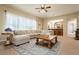 Spacious living room features a comfortable sectional couch, bar area and decorative rug at 12097 Oakland Hills Dr, Las Vegas, NV 89141